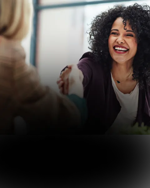 Smiling woman shaking hands