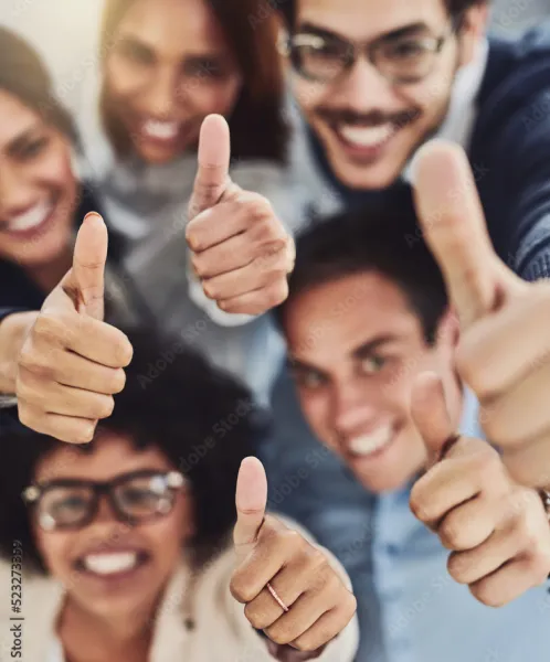 Group smiling with thumbs up